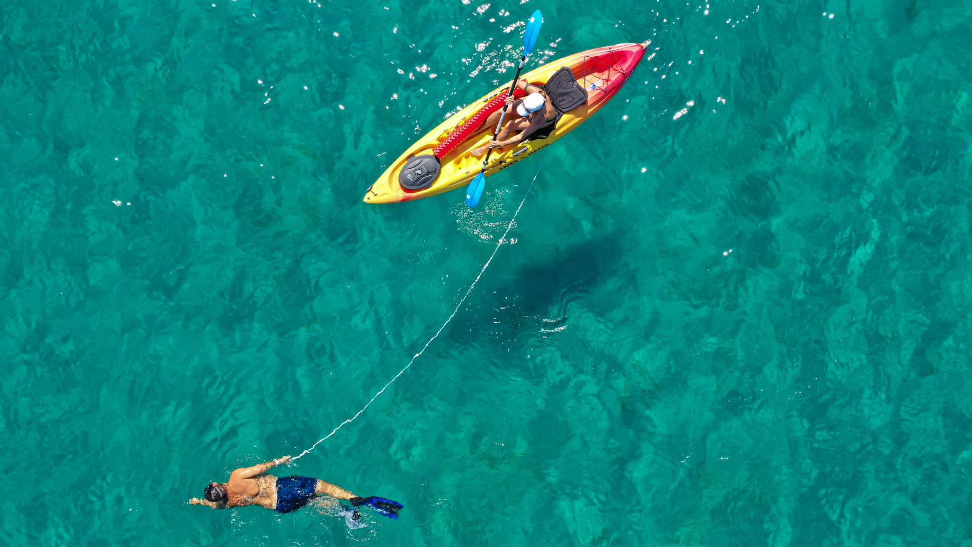 Kayak with swimmer — supporting a partner through their grief